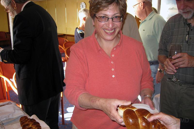 20071206 175428 Canon 4000x2667 .jpg - Cathy breaking challah on Silver Wind at Chanukah